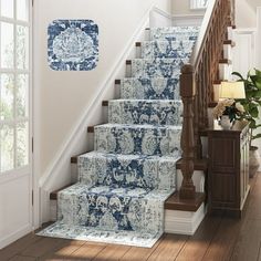 a stair case with blue and white carpet