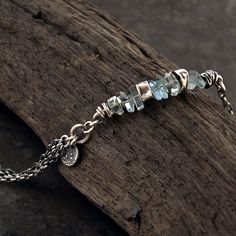 "delcate aquamarine bracelet handmade of oxidized 925 sterling silver, signed, © ewa lompe APPROXIMATE MEASUREMENTS: bracelete size: 6-8\" + 1\" charm size: 8-9 mm cut stone size: ~7-8 mm *The item pictured is not the exact ones that you will receive, but it will be the same design. The matching earrings are here: https://www.etsy.com/listing/692739263/aquamarine-earrings-sterling-silver?ref=shop_home_active_2&pro=1 and here: https://www.etsy.com/listing/776874179/light-blue-aquamarine-earri Oxidized Silver Bracelet, Multi Chain Bracelet, Aquamarine Bracelet, Metalsmithing Jewelry, Bohemian Jewellery, Aquamarine Earrings, Handmade Jewelry Designs, Bracelet Sterling Silver, Birthday Gift For Her