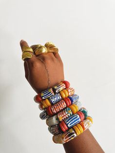 Cowrie Shell Jewelry, African Bracelets, African Dolls, Multiple Bracelets, African Inspired Clothing, Unique Color Combinations, Shell Jewelry, Cowrie Shell, Arm Candy