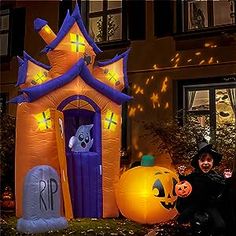 an inflatable halloween house with pumpkins and ghost