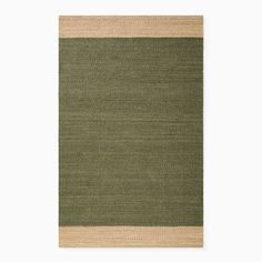 a rug with green and beige stripes on the bottom, in front of a white wall