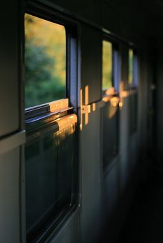 the windows on this train are reflecting sunlight