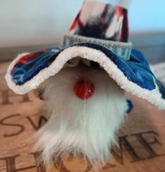 Gnome, Wizard, or Cowboy in patriotic colors.  Red white and blue floppy hat, with white fuzzy trim, denim strap on the hat and star button at the back for flair.  Red nose, red hands, white beard. Handmade from a repurposed mini liquor bottle. Stands approx 5 inches tall. Darling for Farmhouse Decor or hanging from your car mirror.  Comes from a non-smoking home. Let me know if you would like a Gnome made, customized for you! Gnome Wizard, Red Hands, Mini Liquor Bottles, Star Buttons, Liquor Bottle, White Beard, Red Nose, Cow Boy, Liquor Bottles