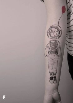 a person with a balloon tattoo on their arm