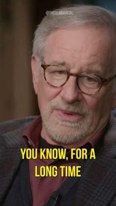 an older man with glasses and a beard is talking to someone on the tv show, you know, for a long time