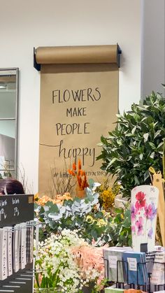 there is a sign that says flowers make people happy