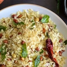 a white plate topped with rice and beans