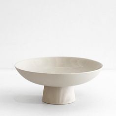 a white bowl sitting on top of a table