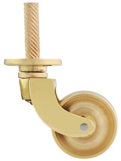 a brass plated pulley with a long handle