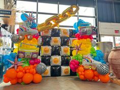 an assortment of balloons and decorations on display