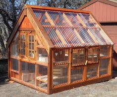 a small wooden house with a metal roof