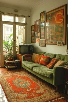 a living room filled with lots of furniture and pictures on the wall above it's windows