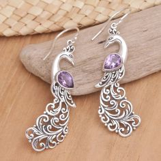 Amethyst is often related to loyalty and friendship. Its stunning purple tone makes it perfect for any style, like these sterling silver dangle earrings featuring charming peacocks with faceted amethyst stones as the centerpiece. This alluring creation is brought from Bali by Komang Wijayana. Purple Peacock, Purple Tone, Peacock Earrings, Amethyst Stones, Silver Dangle Earrings, Sterling Silver Dangle Earrings, Peacocks, Amethyst Stone, Jewelry Earrings Dangle