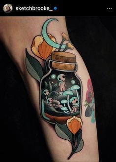 a jar with some flowers in it on the leg