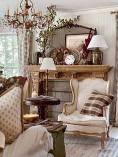 a living room filled with furniture and a fire place in front of a mantle topped with a clock