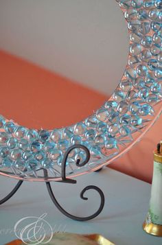 a decorative mirror sitting on top of a table