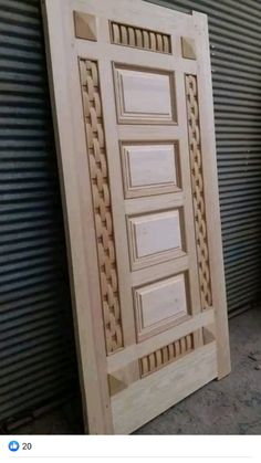 the door is made out of wood and has an intricate design on it's side