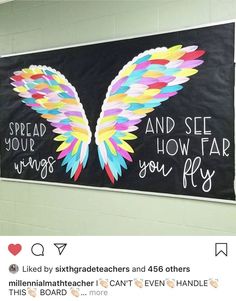 a bulletin board with an angel wing on it and the words spread your wings, how far you fly?