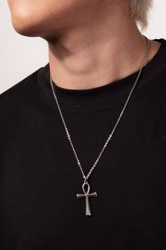 This Stainless Steel Chain Necklace with Ankh Pendant is the perfect blend of style and ancient symbolism. The Ankh pendant, an ancient Egyptian symbol of life, adds a touch of spirituality and cultural significance to this necklace. Whether you're looking to make a fashion statement or simply want to add a meaningful accessory to your collection, this necklace is a great choice. Plus, with its affordable price and versatile design, it makes a great gift for any friend or loved one. Size Length: Cheap Ankh-shaped Spiritual Necklaces, Ankh Necklace Men, Spiritual Ankh Necklace With Adjustable Chain, Symbolic Metal Cross Necklace, Symbolic Cross Necklace With Adjustable Chain, Spiritual Metal Pendant Cross Necklace, Spiritual Metal Cross Pendant Necklace, Symbolic Metal Chain Necklace, Symbolic Stainless Steel Cross Pendant Necklace