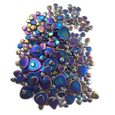 a pile of blue and purple glass pebbles