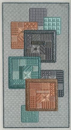 a cross stitch pattern with different colored squares