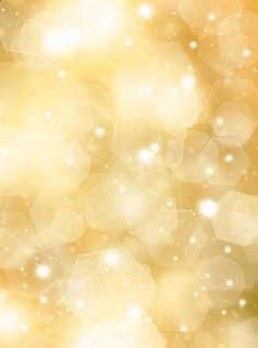 an abstract gold and white background with sparkles