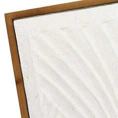 a close up of a mirror on a white background with wood trimming around the edges