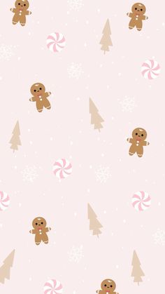 a pink christmas wallpaper with gingerbreads and candy canes