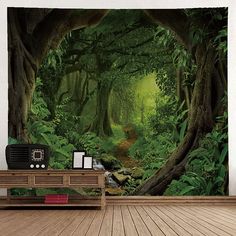 an image of a forest scene with green trees and leaves on the wall, in front of a wooden floor