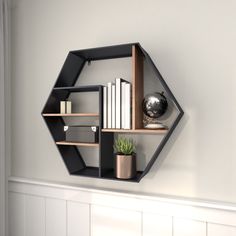 Organize and decorate in style with this geometric floating shelf that would easily complement your industrial-themed living room or office space. This item ships in 1 carton. Can be hung horizontally using the keyholes; nails and screws not included. Suitable for indoor use only. This item ships fully assembled in one piece. Maximum weight limit is 20 lbs. This is a single black colored floating shelf. Metal wall shelf features 5 shelves. Industrial style. Grayson Lane 29.5-in L x 6.75-in D x 2 Black Wall Shelf, Wall Shelf Black, Hexagon Wall Shelf, Pipe Bookshelf, Iron Pipe Shelves, Black Wall Shelves, Shelves Industrial, Vintage Inspired Wall Decor, Hexagon Wall