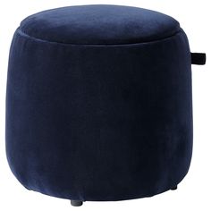 the foot stool is made from dark blue velvet