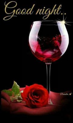 a red rose sitting next to a wine glass with the words good night on it