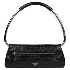 Prada Midnight Blue Matte Alligator Leather Ring Top Handle Shoulder Bag Brand- Prada Model- Ring Top Handle Shoulder Bag Product Type- Shoulder, Top Handle Colour- Midnight Blue Hardware- Silver Material(s)- Matte Alligator Leather Authenticity Details- The serial tag is no longer present. Limited Edition- Yes Height- 12cm Width- 29cm Depth- 3cm Handle Drop- 20cm Interior- Black Satin Closure- Zip, Button Country of Origin-Italy CITES/Export Restrictions- Please note, this item may be subject to CITES regulations when exported outside of the UK. Please contact us for further information. Condition Rating- Excellent Exterior Condition- The exterior is in excellent condition with light signs of use. Interior Condition- The interior is in excellent condition with light signs of use. Hardware Vintage Handbag, Leather Ring, Prada Model, Bag Brand, Vintage Handbags, Silver Material, Black Satin, Fashion Handbags, Midnight Blue