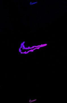 the nike logo glows purple in the dark