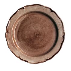 a brown plate is shown on a white background with the edge of it's rim