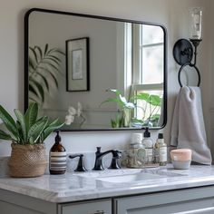 a bathroom sink with a mirror and soap dispenser