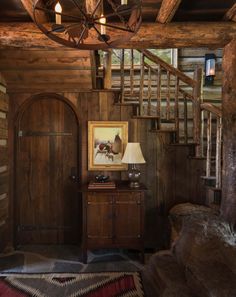 a room with wooden walls and stairs