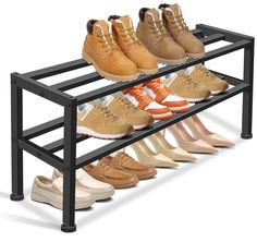 the shoe rack is filled with many pairs of shoes