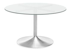 a round glass table with metal base