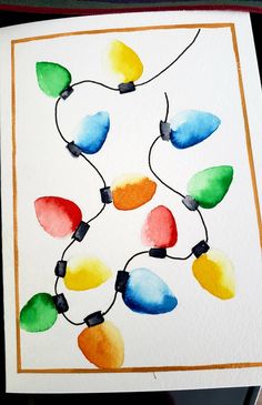 watercolor christmas lights on white paper with red frame