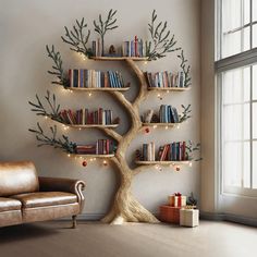 a living room with a couch, book shelf and christmas tree decoration on the wall