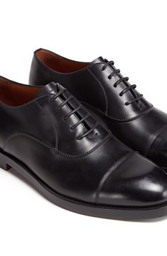 Crafted with flexible, lightweight Blake construction, this Italian-made oxford with a richly polished finish pairs classic elegance with contemporary flair. Lace-up style Leather upper and lining/leather and synthetic sole Made in Italy Men's Designer Shoes Elegant Cap Toe Oxford For Semi-formal Occasions, Elegant Semi-formal Oxford Shoes With Cap Toe, Elegant Semi-formal Cap Toe Oxford Shoes, Elegant Semi-formal Cap Toe Oxford, Classic Fitted Plain Toe Oxford, Timeless Oxfords For Workwear, Classic Fitted Oxfords For Derby, Classic Fitted Oxfords For Derby Events, Classic Fitted Oxford For Derby