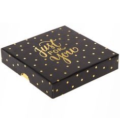 a black box with gold dots and the words just for yoga on it's lid