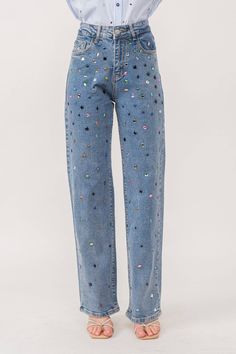 Rhinestone denim pants Stretch denim Straight leg fit Multicolor hotfix rhinestone embellishment. Front zip and button closure Classic 5-pocket construction Styled with Model is 5 ft 6 in, wearing a Small. Bust: 32 in Waist: 24 in Hips: 35 Late 20s Womens Fashion, Concert Outfit Comfortable, Rhinestone Denim Jeans, Sequin Jeans Outfit, Moda Operandi Pants, Decorated Jeans School Spirit, Denim Rhinestone Outfit, Denim With Lace, Rhinestone Jeans Diy