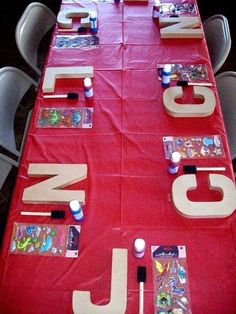 the table is covered with red cloth and letters that spell out jnj on it