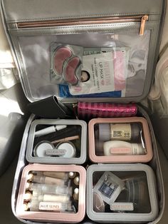 an open suitcase filled with cosmetics and personal care items