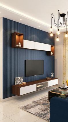 a modern living room with blue and white wallpaper, chandelier and entertainment center