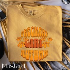 Celebrate the season with our Pregnant Girl Autumn T-Shirt! Featuring a fun retro graphic design in warm autumn colors, this Comfort Colors® tee offers both comfort and style. Perfect for expecting mothers, this cozy casual wear is great for fall outings, baby showers, or just relaxing at home. Made from high-quality materials, it ensures a soft and durable wear. An ideal gift for moms-to-be who want to embrace the autumn vibe with a touch of nostalgia. Thank you for visiting my shop. Please con Fall Outings, Pregnant Girl, Baby Announcement Shirt, Baby Announcement Shirts, Retro Graphic Design, Autumn T Shirts, Groovy Retro, Pregnancy Reveal, Pregnancy Gifts