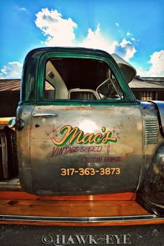 an old truck with the name magic's garage speed custom garage painted on it