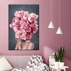 a woman with pink flowers on her head in a living room next to a couch